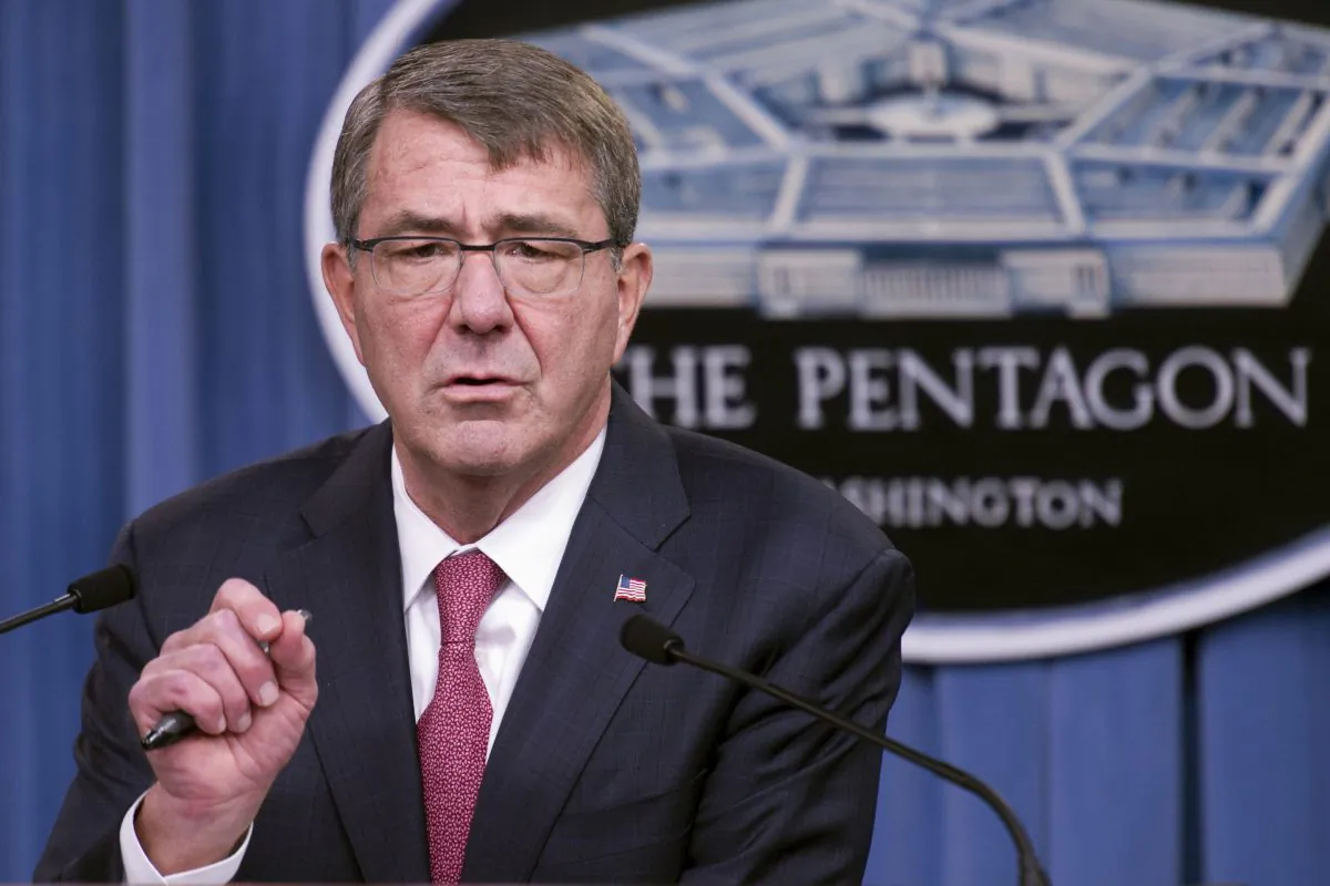 Defense Secretary Ash Carter gestures during a news conference at the Pentagon on Dec. 3, 2015, where he announced that he has ordered the military to open all combat jobs to women, and is giving the armed services until Jan. 1 to submit plans to make the historic change. (AP Photo/Cliff Owen)