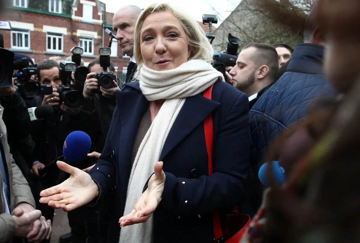 Marine Le Pen, French conservative leader of right-wing party National Front, leaves the polling station after voting for the first round of regional elections, Sunday, Dec. 6, 2015, in Henin-Beaumont, northern France. (AP Photo/Michel Spingler)