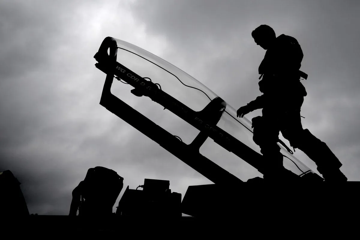 Flight Lieutenant Ian Abson, from RAF 617 squadron based at Lossiemouth, Scotland, inspects a Tornado during War Week Mission Rehearsal Exercise, in preparation for their final Afghanistan deployment on Oct. 2, 2013, in Lossiemouth. (Jeff J. Mitchell/Getty Images)