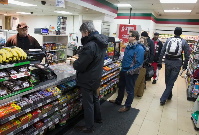 Customers line up to purchase Powerball lottery tickets at a 7-Eleven store on February 11, 2015 in Chicago, Illinois. (Scott Olson/Getty Images)