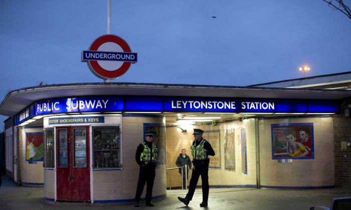 British police officers stand outside Leytonstone underground train station in east London. (Matt Dunham/AP Photo)