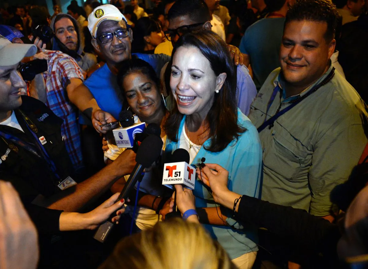 Venezuelan opposition ex-congresswoman María Corina Machado speaks with the press following the results of the legislative election in Caracas, Venezuela, on Dec. 7, 2015. (Federico Parra/AFP/Getty Images)