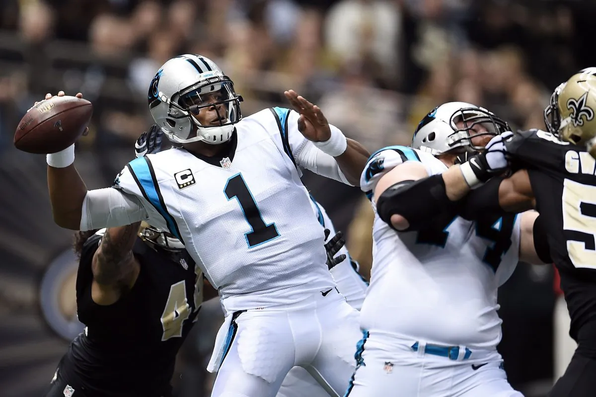 Cam Newton drops back to pass against the New Orleans Saints at the Mercedes-Benz Superdome on Dec. 6 in New Orleans. The Carolina quarterback took a big step toward NFL MVP honors with his performance. (Stacy Revere/Getty Images)