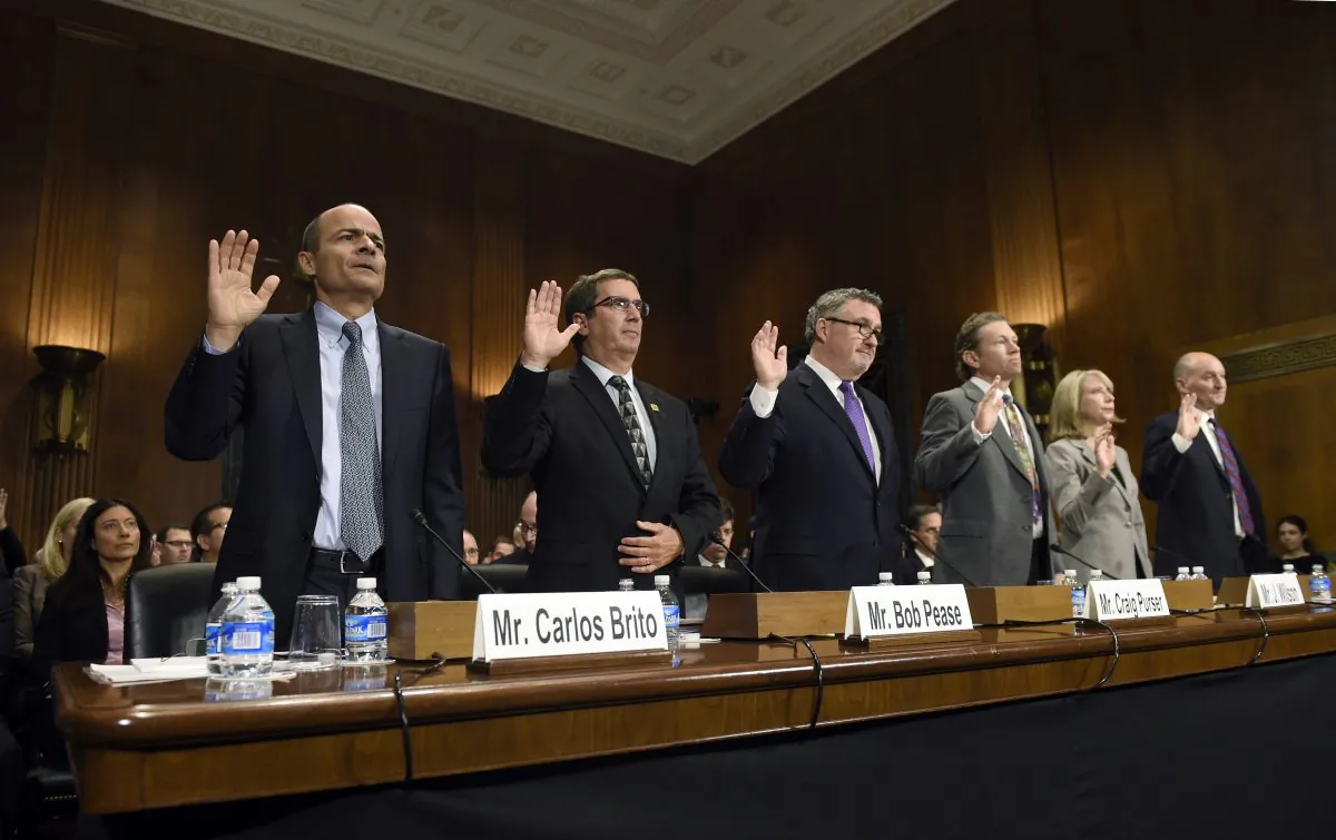 (L-R) Anheuser-Busch InBev Chief Executive Officer Carlos Brito, Brewers Association Chief Executive Officer Bob Pease; National Beer Wholesalers Association President and Chief Executive Officer Craig Purser, Iowa Brewers Guild Minister of Iowa Beer J. Wilson, American Antitrust Institute President Diana Moss, and Molson Coors President and Chief Executive Officer Mark Hunter are sworn in to testify before the Senate Antitrust, Competition Policy and Consumer Rights Subcommittee on Capitol Hill in Washington, D.C., Tuesday, Dec. 8, 2015, during a hearing on world's two biggest beer makers, Anheuser Busch InBev and SABMiller, deal to join forces to create a company that produces almost a third of the world's beer. (AP Photo/Susan Walsh)