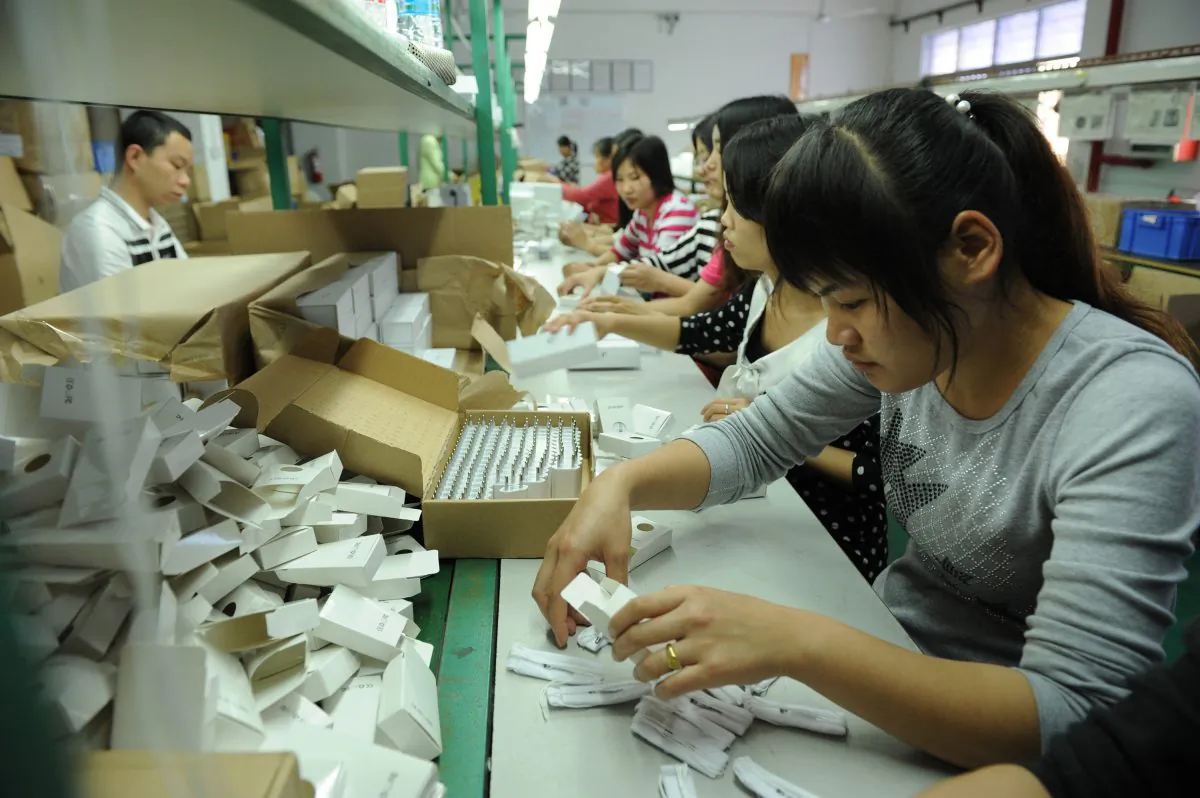 Chinese workers packing electronic cigarettes at a factory in Shenzhen, in southern China's Guangdong Province, on March 12, 2013. (STR/AFP/Getty Images)