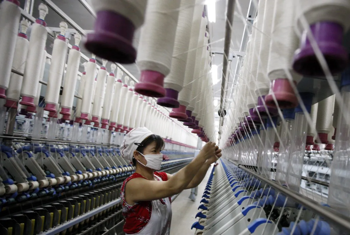 A worker in a textile factory in Huaibei, in north China's Anhui province on July 24, 2013. (STR/AFP/Getty Images)