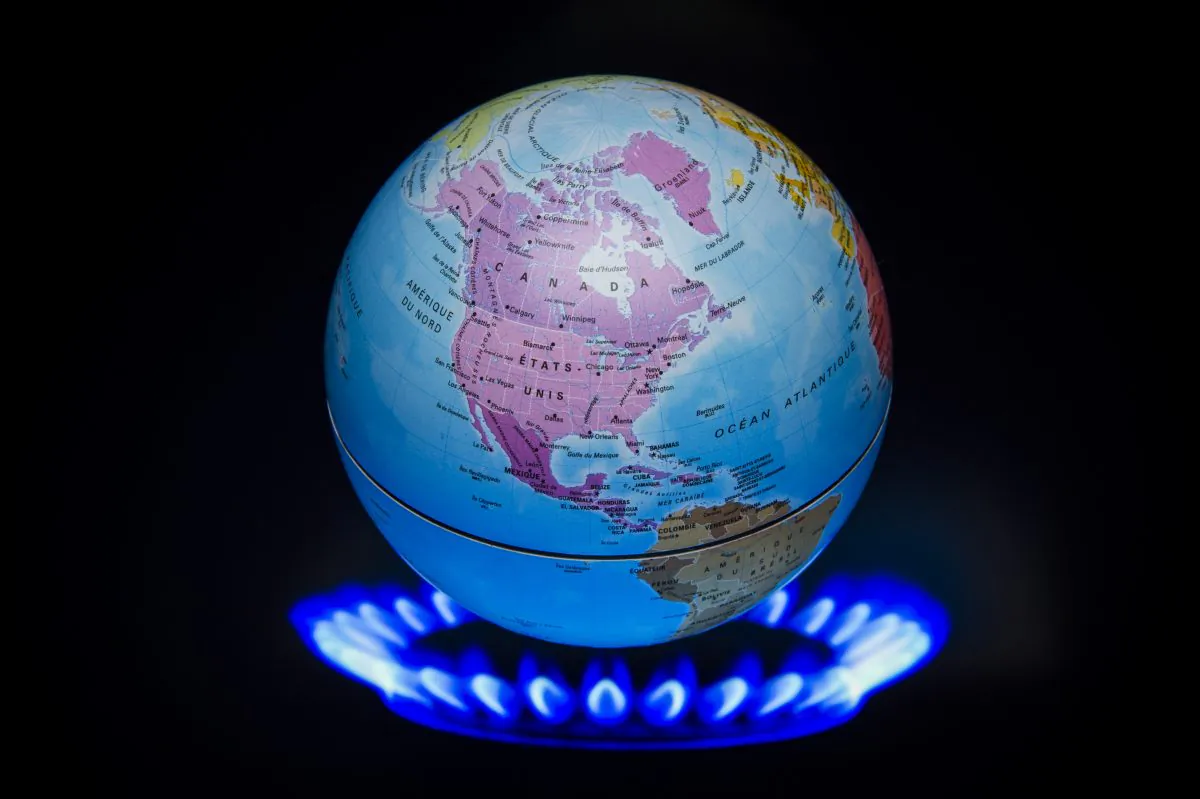 A small globe above a fire to illustrate global warming is seen during the 21st Session of the Conference of the Parties to the U.N. Framework Convention on Climate Change (COP21/CMP11), in France, on Nov. 4, 2015. (Lionel Bonaventure/AFP/Getty Images)