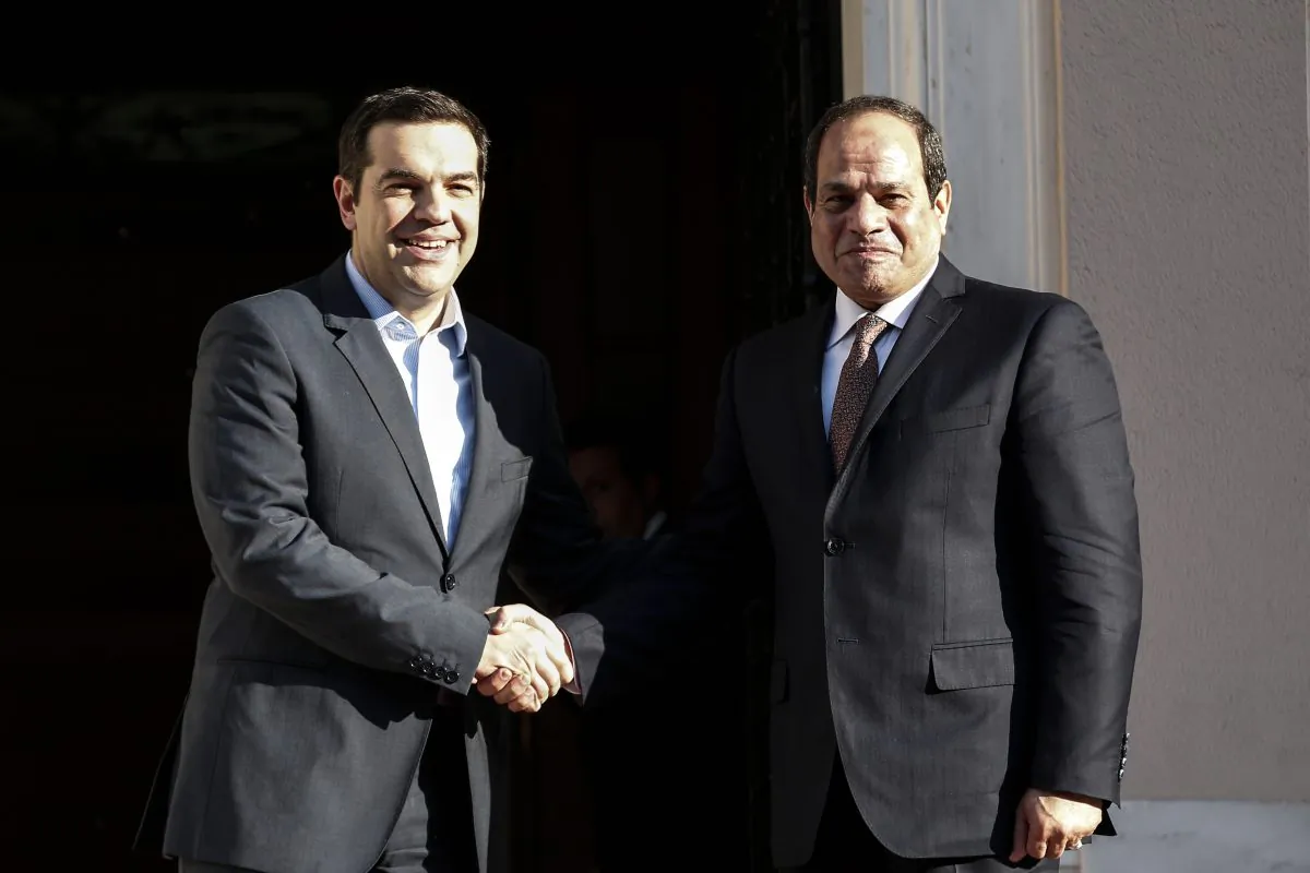 Greece's Prime Minister Alexis Tsipras (L) welcomes Egyptian President Abdel Fattah el-Sissi in Athens on Tuesday, Dec. 8, 2015. Egyptian President Abdel Fattah el-Sissi is in Athens for a two-day visit that will focus on energy and shipping, as financially troubled Greece seeks economic cooperation with regional partners. (AP Photo/Yorgos Karahalis)