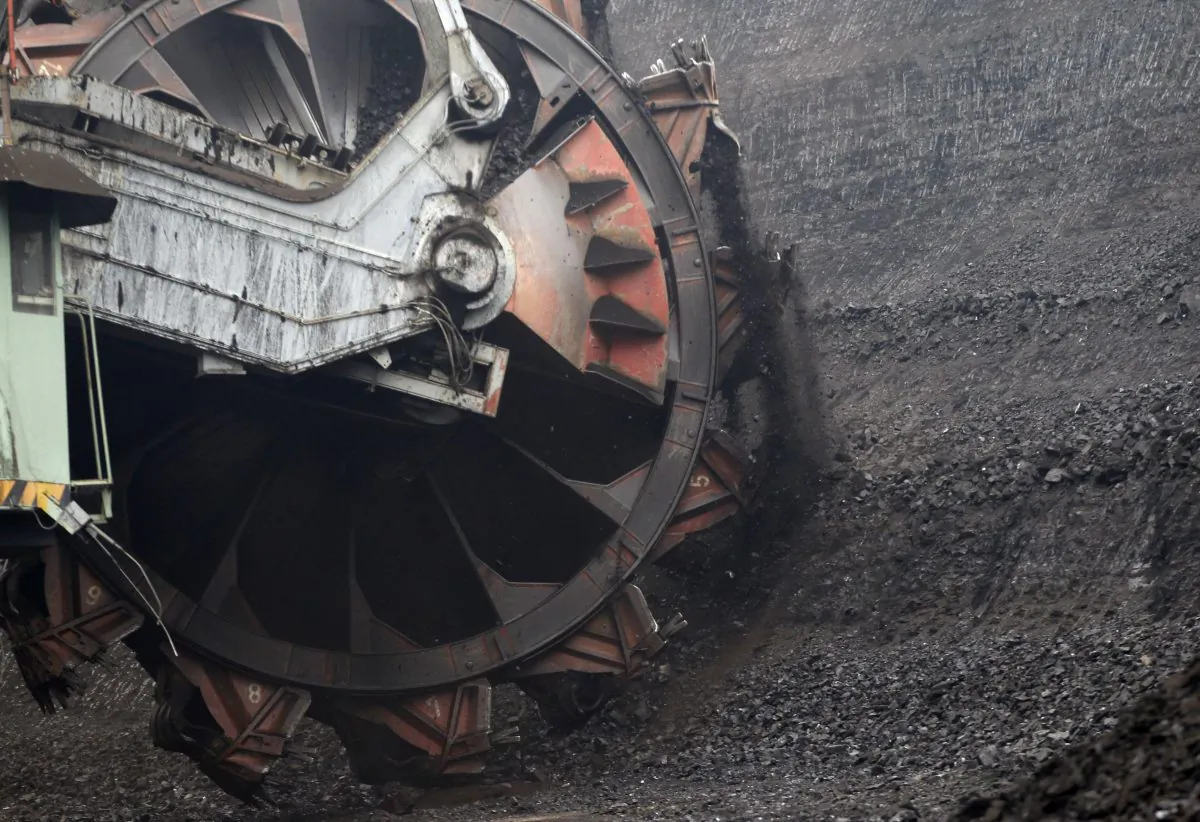 A huge excavator digs inside a giant open pit lignite mine in Most Town, Czech Republic, on Nov. 6, 2015. Ahead of the U.N. climate conference in Paris, the Czech government approved a plan to expand the mining of lignite, a fossil fuel known as brown coal, a major source of greenhouse gases. (AP Photo/Petr David Josek)