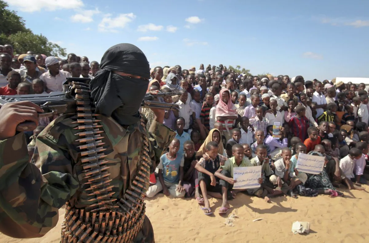 An armed member of the terrorist group al-Shabab attends a rally in support of the merger of the fundamentalist Somalia Islamic group with al-Qaida, on the outskirts of Mogadishu, Somalia, on Feb. 13, 2012. (AP Photo)