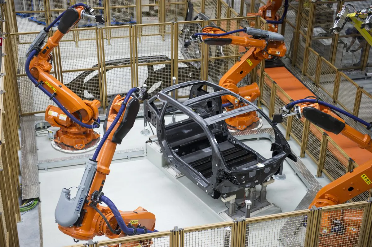 Robots manufacture a carbon chassis of a new BMW i3 electric car on the assembly line at the BMW factory on September 18, 2013 in Leipzig, Germany. (Jens Schlueter/Getty Images)
