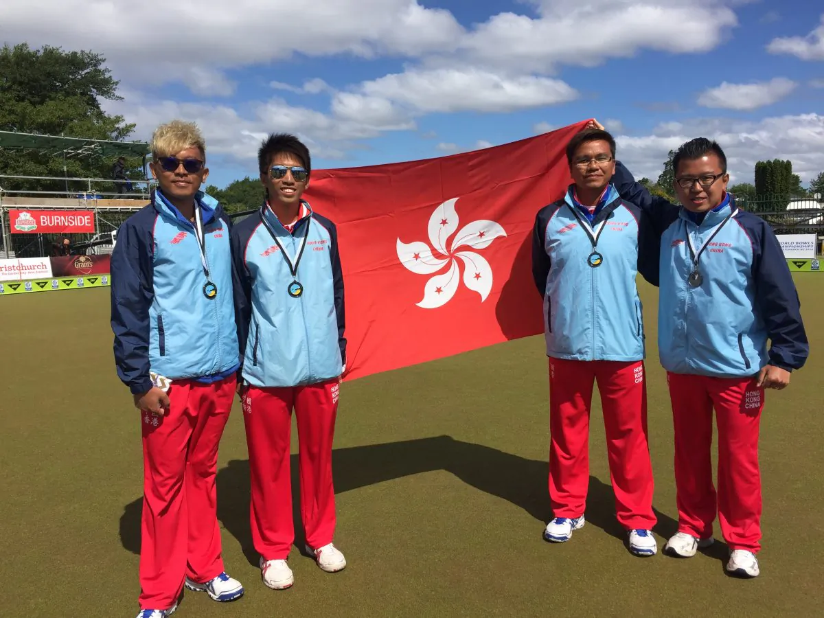 HONG KONG GLORY– the Hong Kong Fours team consisting of (L-R) CY Wong, Jason Choi, Tony Cheung and Terry Kung who won a bronze medal at the Asia Pacific Championships in Christchurch, New Zealand, last week (Dec 4, 2015) proudly display the Hong Kong flag after receiving their medals. (Andrea Chan)