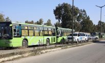 Amid a Local Truce, Syrians Leave Rebel-Held Area in Homs