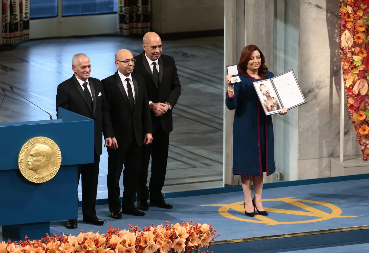 The winners of the 2015 Nobel Prize, Tunisian National Dialouge Quartet members,  from left to right,  Houcine Abassi, Mohamed Fadhel Mahfoudh, Abdessattar Ben Moussa and Wided Bouchamaoui, holding the award at the Nobel Peace Prize award ceremony in Oslo, Norway, Wednesday Dec.10. 2015. (Haakon Mosvold Larsen / NTB scanpix via AP)