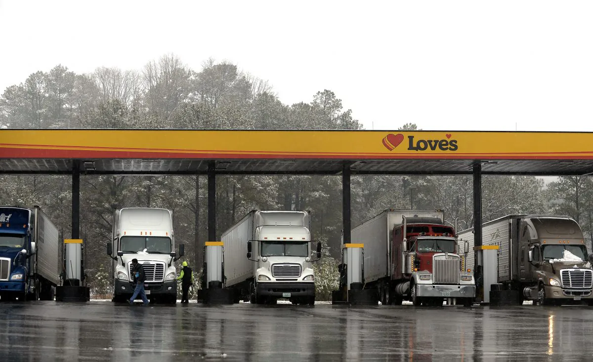 Truck drivers stop at a gas station in Emerson, Ga., north of metro Atlanta, on Feb. 11, 2014, to fill up their tractor trailer rigs. (David Tulis/AP Photo)