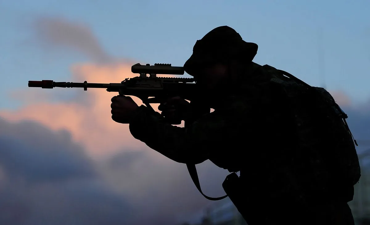 A soldier looks through the sights of his rifle as part of exercise Talisman Sabre in Rockhampton, Australia, on July 9, 2015. (Ian Hitchcock/Getty Images)
