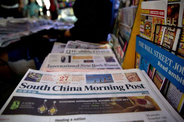 Copies of the South China Morning Post are displayed for sale at a newsstand in Hong Kong on Nov. 28, 2015. On Nov. 11, Jack Ma's Alibaba Group bought the 112-year-old publication and its media assets. (Dale de la Rey/AFP/Getty Images)