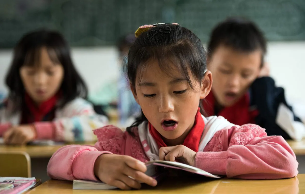 A Chinese schoolgirl attends class in China's Hunan Province on Oct. 8, 2015.  (Johannes Eisele/AFP/Getty Images)