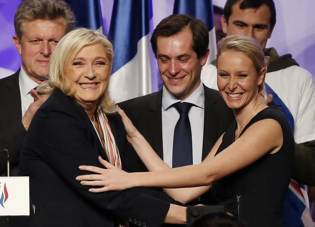 Marine Le Pen (L), president of French far-right National Front (FN) party, and Marion Marechal-Le Pen (R), vice president of FN, at a campaign rally in Paris on Dec. 10, 2015. (Patrick Kovarik/AFP/Getty Images)