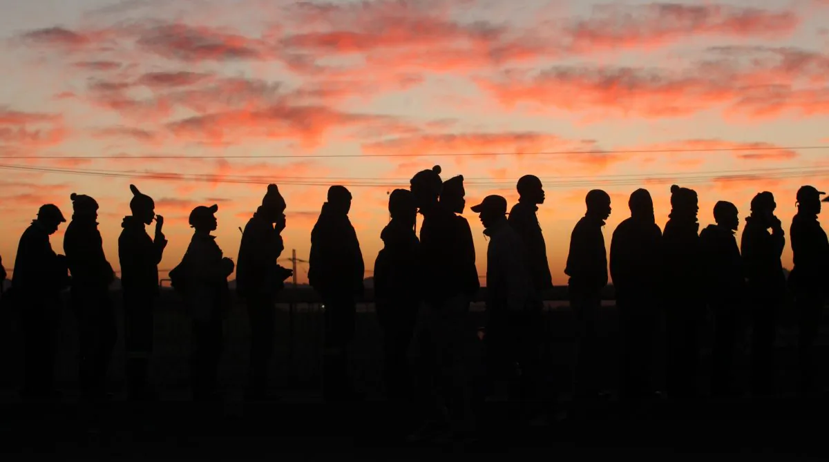 Platinum mineworkers report for work at Lonmin, Anglo American Platinum mine in Marikana, South Africa, on June 25, 2014, following the resolution of the five-month strike in the sector. (Denis Farrell/AP Photo)