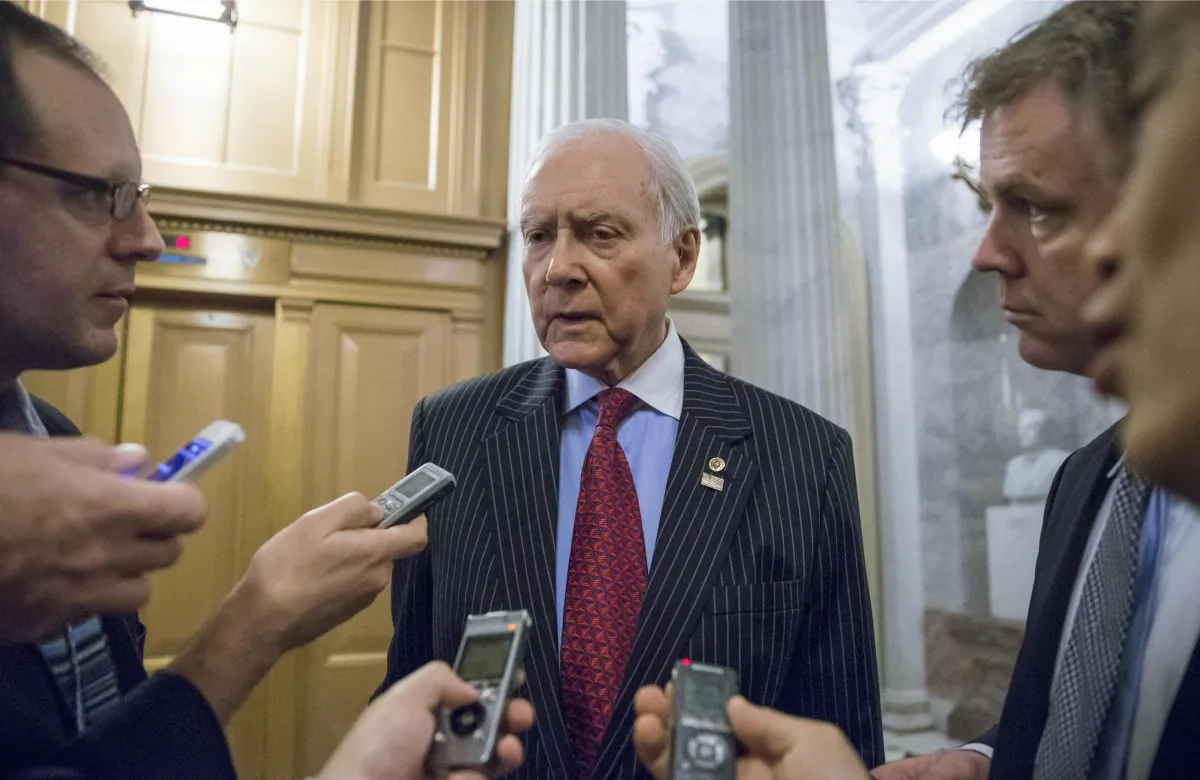 Senate Finance Committee Chairman Sen. Orrin Hatch (R-Utah), who also serves as the Senate's president pro tempore, speaks with reporters outside the Senate chamber on Capitol Hill in Washington, D.C., Monday, Dec. 14, 2015, as lawmakers rush to wrap up their work and pass a funding bill to avert a government shutdown. Congressional negotiators worked through the weekend on a $1.1 trillion spending bill and a package of tax breaks, with Republicans and Democrats promising that a final product will be unveiled on Monday. (AP Photo/J. Scott Applewhite)