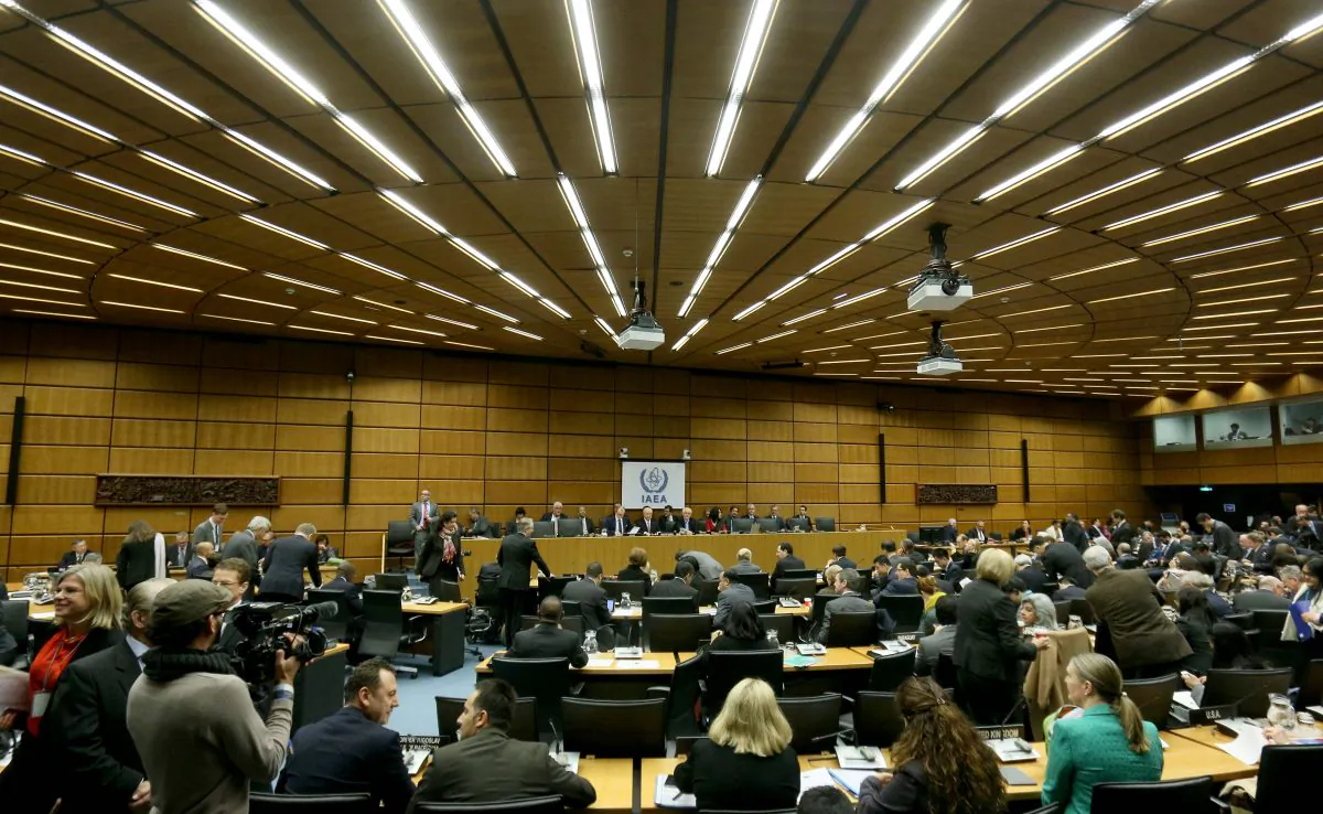 Delegates wait for the start of the board of governors meeting of the International Atomic Energy Agency (IAEA) at the International Center in Vienna, Austria, Tuesday, Dec, 15, 2015. The U.N. nuclear agency is set to close the books on a decade-long probe of allegations that Iran worked on atomic arms. (AP Photo/Ronald Zak)