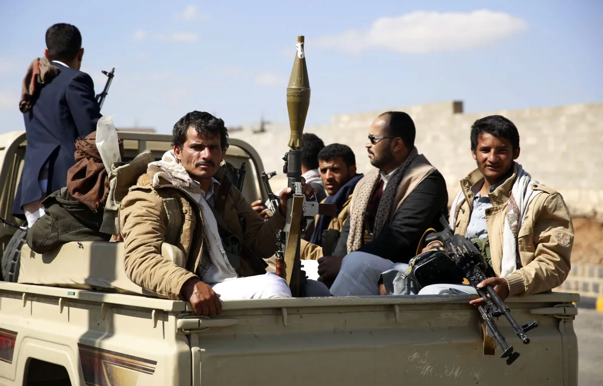 Tribesmen loyal to Shiite, known as Houthis, ride on a pickup truck as they attend a tribal gathering showing support for the Houthi movement in Sanaa, Yemen, Monday, Dec. 14, 2015. (AP Photo/Hani Mohammed)