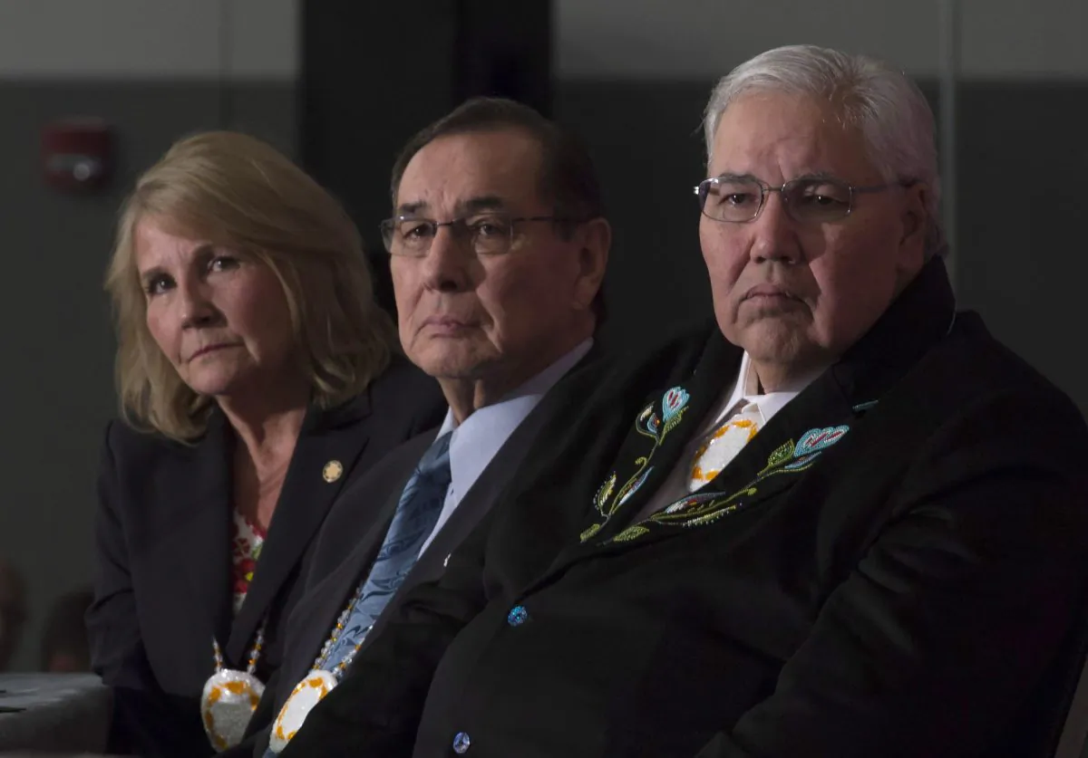 (L-R) Commissioner Marie Wilson, Commissioner Chief Wilton Littlechild, and Commissioner Justice Murray Sinclair listen to a speaker as the final report of the Truth and Reconciliation commission is released on December 15 in Ottawa. (THE CANADIAN PRESS/Adrian Wyld)