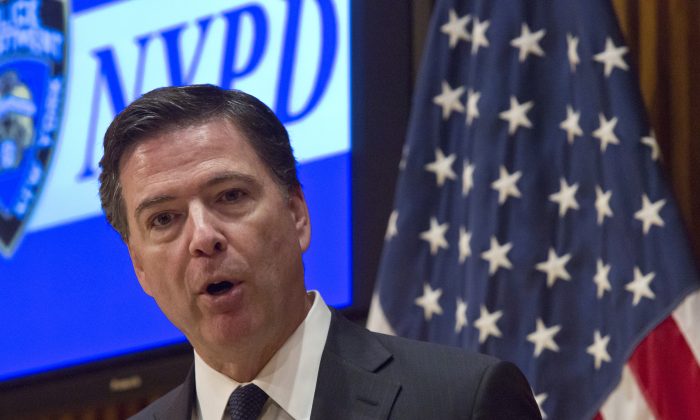 FBI Director James Comey speaks during a press conference after addressing the NYPD Shield Conference at NYPD headquarters, Wednesday, Dec. 16, 2015, in New York. (AP Photo/Bebeto Matthews)