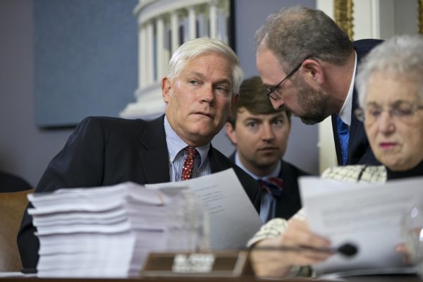 House Rules Committee Chairman Pete Sessions (R-Texas) (L), with Rep. Virginia Foxx (R-N.C.) (R), confers with staff as the panel examines the $1.1 trillion spending bill to fund the government for the 2016 budget year and extend $680 billion in tax cuts for businesses and individuals, at the Capitol in Washington, D.C., on Dec. 16, 2015. President Barack Obama is expected to sign the legislation. (AP Photo/J. Scott Applewhite)