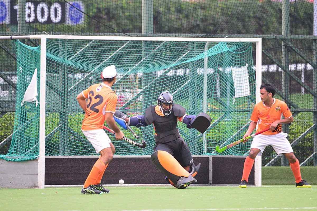 Unstoppable: SSSC-A keeper Gurdev Singh, who was voted ‘Man of the Match’ watches in vain as Khalsa-A’s player/coach buries his penalty corner to hand Khalsa-A a 2-1 victory in the Guru Nanak Cup final, at Happy Valley on Sunday Dec 13, 2015. (Eddie So)