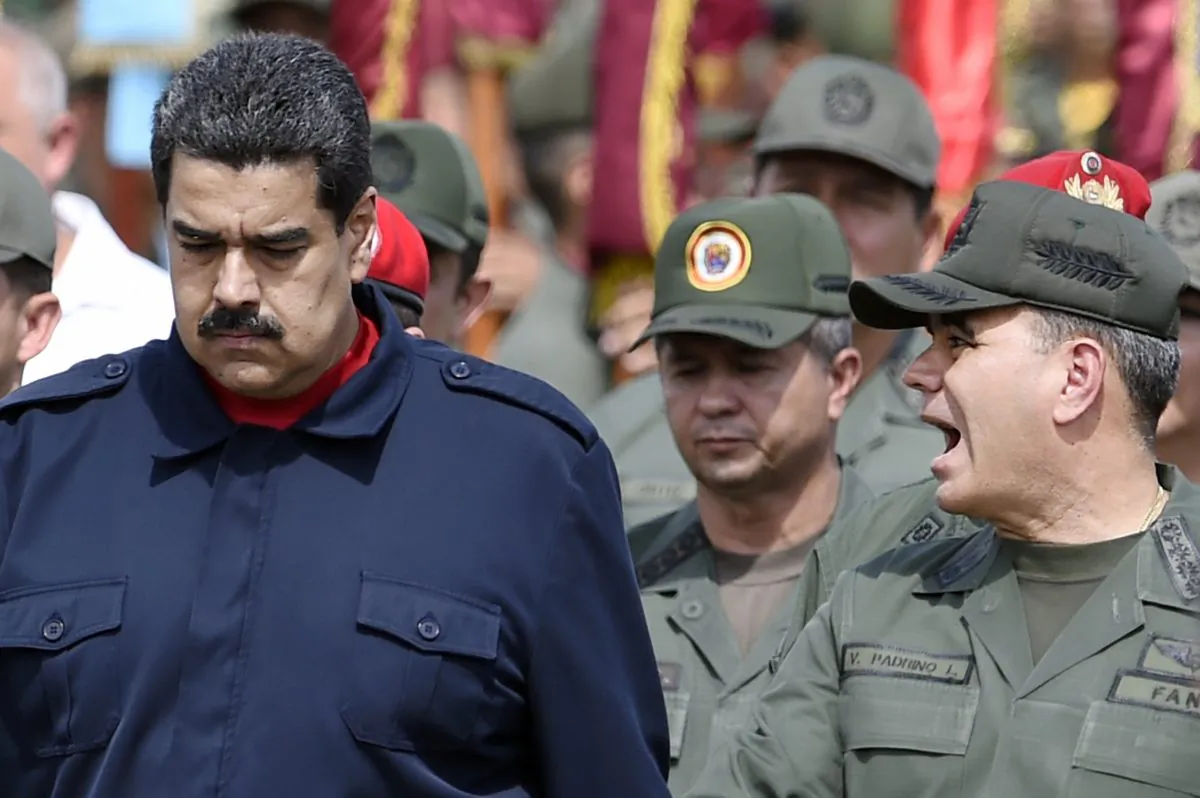 Venezuelan President Nicolás Maduro (L) walks with Venezuelan Defense Minister Padrino López (R) during a military parade in Caracas on Dec. 12, 2015. (Juan Barreto/AFP/Getty Images)
