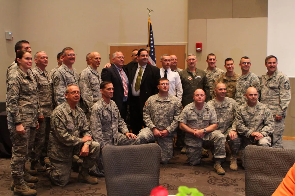 Walter O'Brien, CEO of Scorpion Security, stands for a photo with several military colonels during a meeting at the Northeast Indiana Defense Industry Association Mega Conference in October. O'Brien has been trying to help the Pentagon and U.S. government improve their cybersecurity. (Randy Jackson)