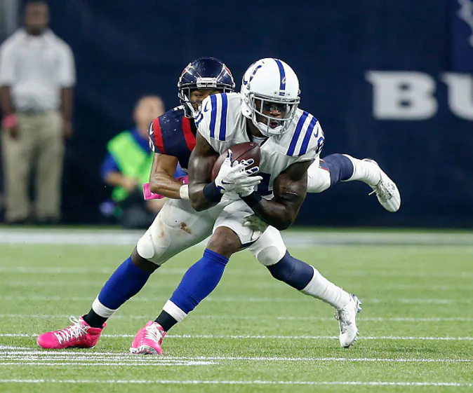 HOUSTON, TX - OCTOBER 08: Andre Johnson #81 of the Indianapolis Colts tackled by Kevin Johnson #30 of the Houston Texans after a reception in the second half at NRG Stadium on October 8, 2015 in Houston, Texas. (Photo by Bob Levey/Getty Images)