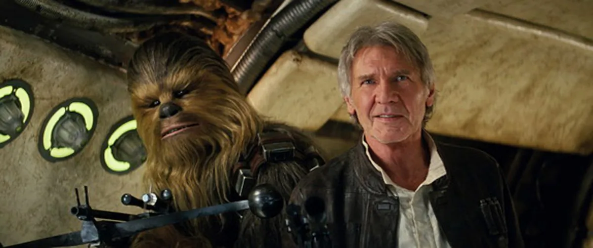 This photo provided by Lucasfilm shows Peter Mayhew as Chewbacca and Harrison Ford as Han Solo in "Star Wars: The Force Awakens," directed by J.J. Abrams. Lawrence Kasdan co-wrote the screenplay with Abrams. The movie opens in U.S. theaters on Friday, Dec. 18, 2015. (Film Frame/Lucasfilm via AP) -