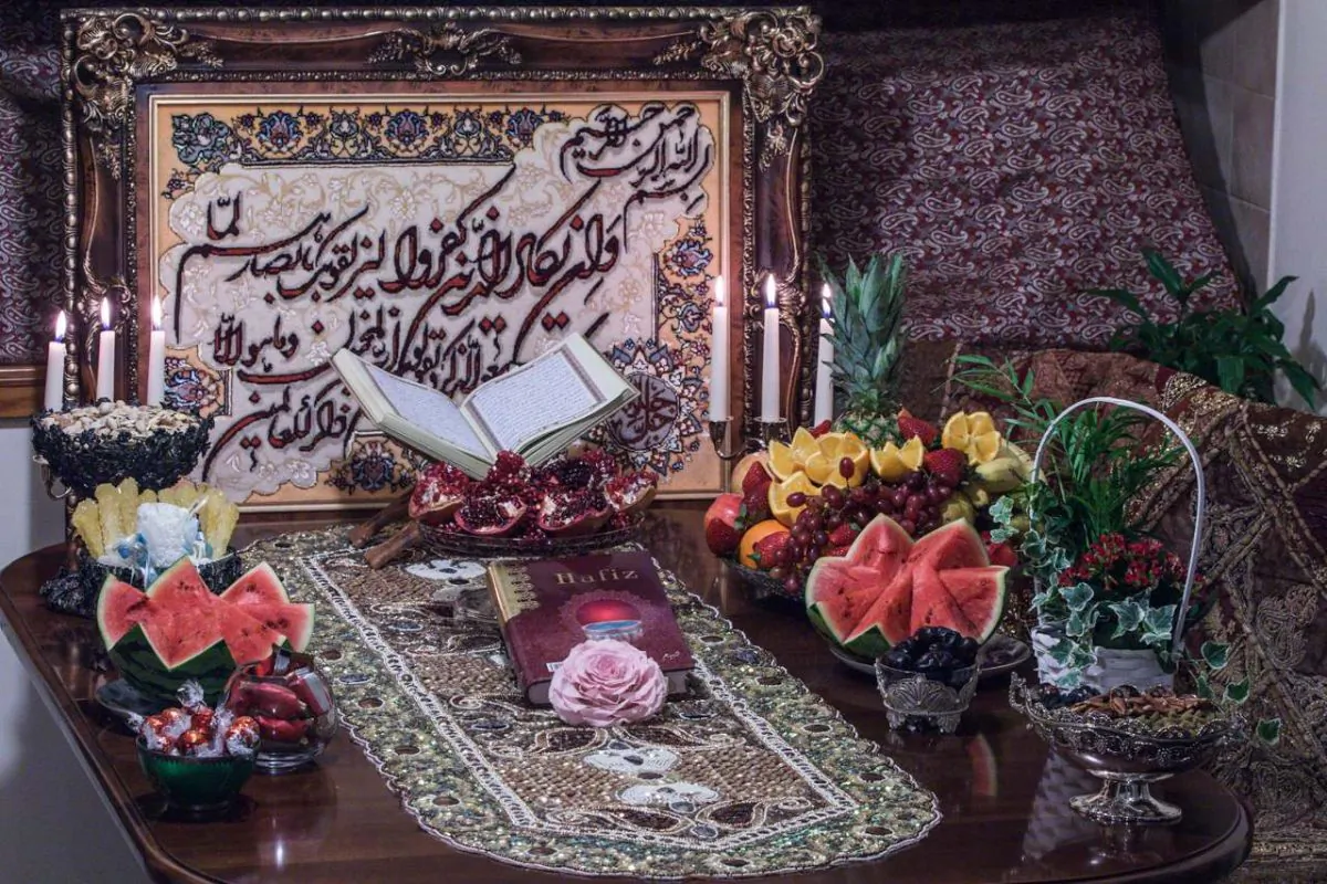 The Yalda table setting consists of Quran, Divan-e-Hafez (Poems of Hafez), fruits and Ajeel (dried fruits). (Mohammed Reza Amirinia)