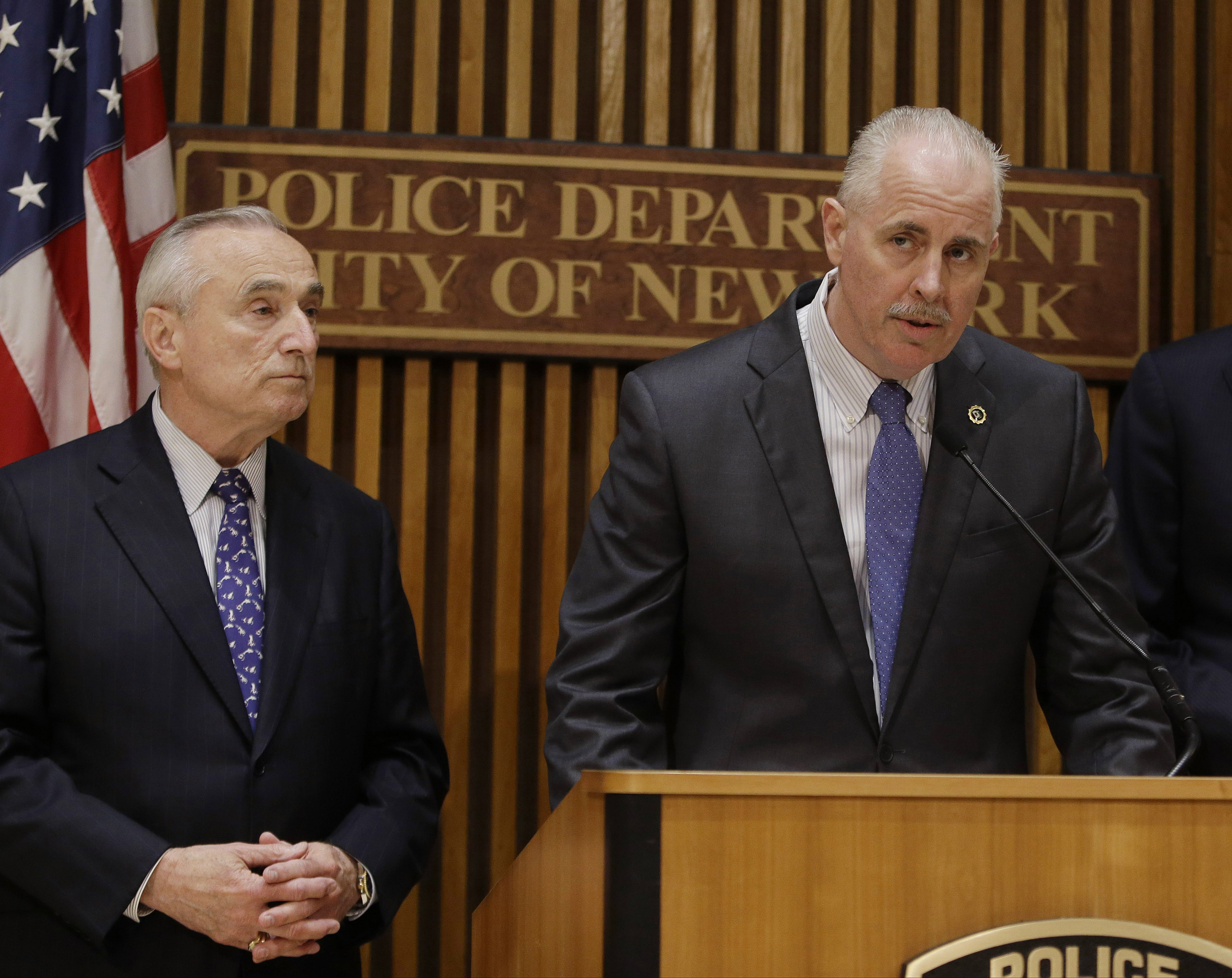 New York Police Chief of Detectives Robert Boyce speaks to the media as Police Commissioner William J. Bratton (l) looks on, in New York, on June 4, 2014. Although outlaw street gangs are engaging in more of a white-collar variety of crime, they are not shifting away from violence. In an interview with The Associated Press, Boyce recently said that,