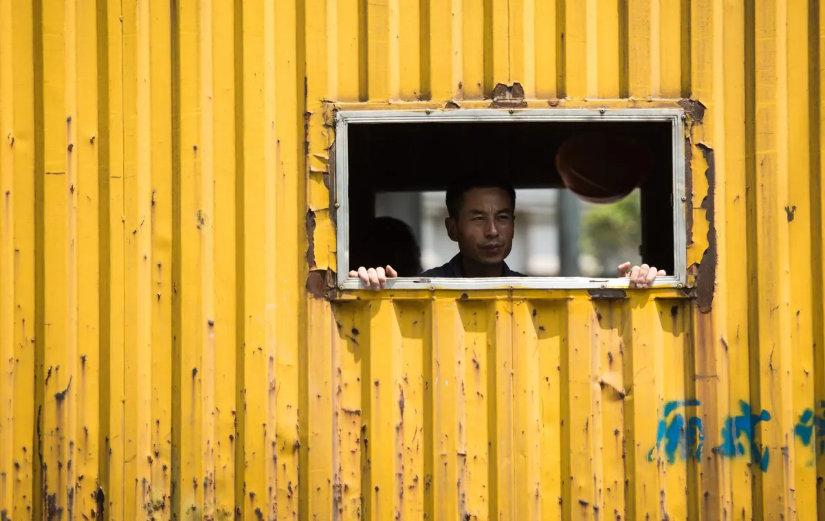A worker on a truck in Shanghai on Aug. 14, 2015. (Johannes Eisele/AFP/Getty Images)