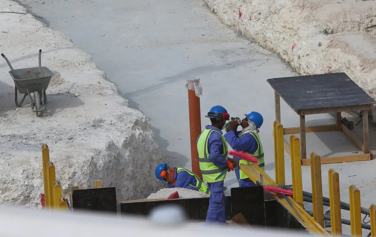 Foreign labourers work at the construction site of the al-Wakrah football stadium, one of the Qatar's 2022 World Cup stadiums, in Doha's Al-Wakrah southern suburbs, on May 4, 2015. (Marwan Naamani/AFP/Getty Images)