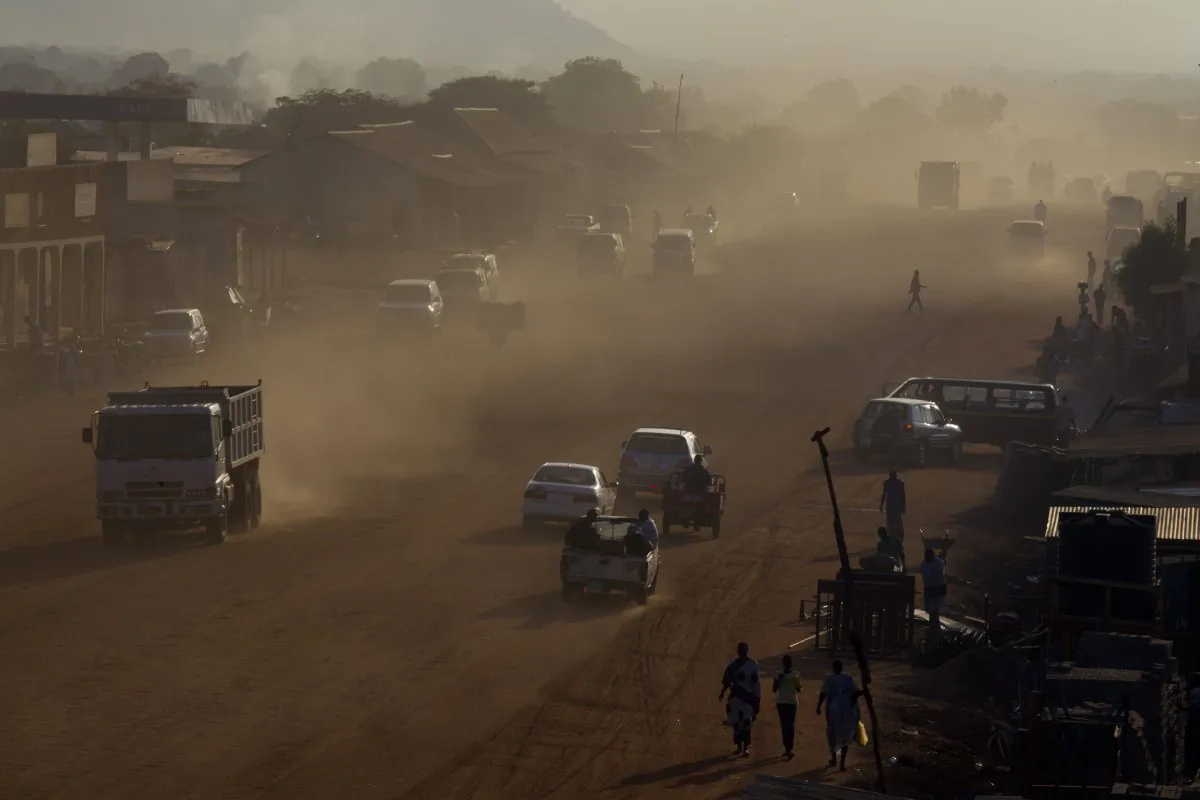 Dust is seen in the air as traffic moves along a major road under construction as the government continues to make improvements on the city's streets in Juba, South Sudan, on July 19, 2012. (Paula Bronstein/Getty Images)