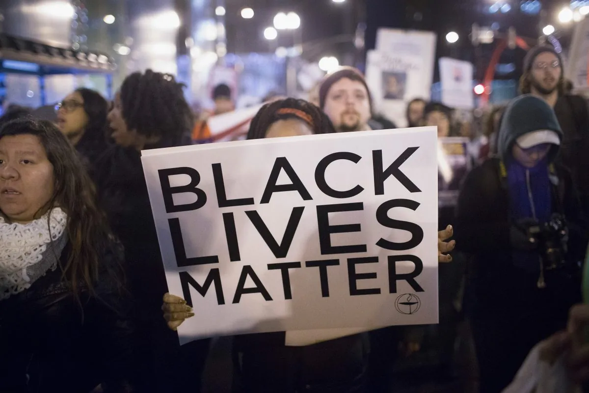 Demonstrators march through downtown calling fror the resignation of Mayor rahm Emanuel on December 10, 2015 in Chicago, Illinois. (Scott Olson/Getty Images)