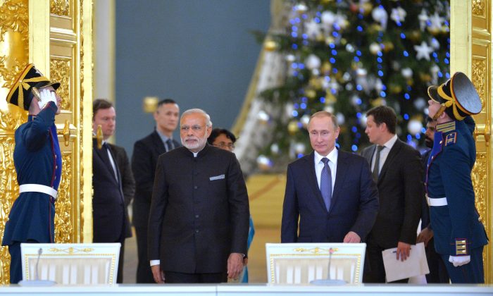 Russian President Vladimir Putin and Indian Prime Minister Narendra Modi arrive to attend a meeting with Russian and Indian officials and businessmen in the Kremlin in Moscow, on Dec. 24, 2015. (Alexei Druzhinin, Sputnik,  Kremlin Pool Photo via AP/Getty Images)