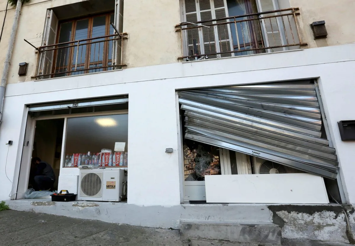 The damaged window of a Muslim prayer room in Ajaccio, on the French Mediterranean island of Corsica, Saturday, Dec. 26, 2015. (AP Photo/Jean-Pierre Belzit)