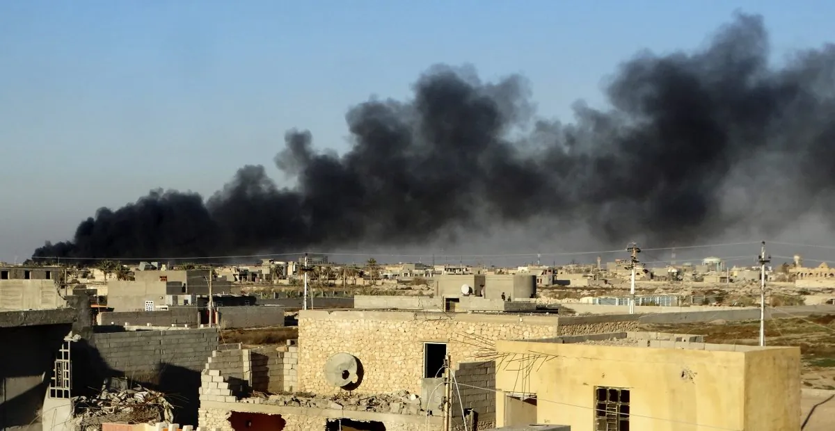 In this Friday, Dec. 25, 2015 photo, smoke rises from Islamic State positions following a U.S.-led coalition airstrike as Iraqi Security forces advance their position in downtown Ramadi, 70 miles (115 kilometers) west of Baghdad, Iraq. Iraqi forces entered the Huz at dawn, an area housing a government compound in the center of Ramadi, part of a major offensive aimed at dislodging the Islamic State terrorist militia from the western city, an Iraqi official said. (AP Photo)
