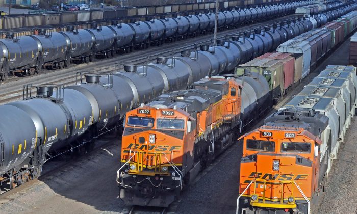 Lines of oil tanker cars sit in the busy Mandan railroad yard in Mandan, N.D., on Nov. 6, 2015. (Tom Stromme/The Bismarck Tribune via AP) 
