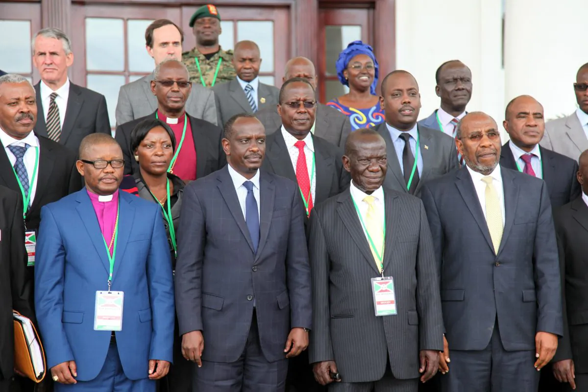 Uganda Vice President Edward Sekandi (2L), Uganda Prime Minister Dr. Ruhakana Rugunda (R), and East African Community Secretary-General Dr. Sezibwera (2R) pose with others, during Burundi peace talks at Entebbe State House, about 42 kilometers east of Uganda capital Kampala, on Dec. 28, 2015. Representatives of Burundi's government and the opposition are in Uganda for negotiations aimed at ending political violence. Burundian President Pierre Nkurunziza, whose decision to run for election to a third term triggered the bloodshed, wasn't present at the opening ceremony Monday. (AP Photo/Stephen Wandera)