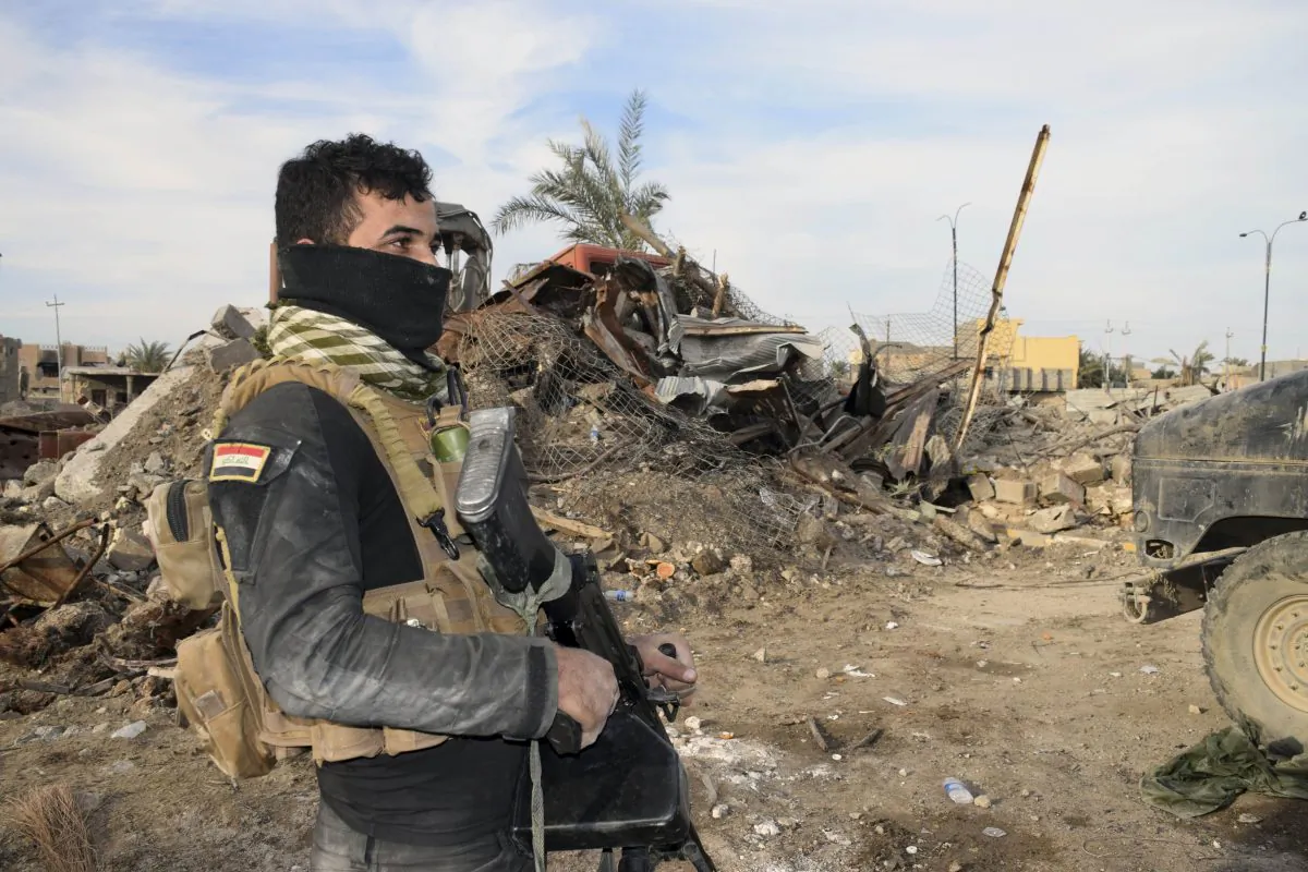 Iraqi Security forces enter the heavy damaged downtown Ramadi, 70 miles (115 kilometers) west of Baghdad, Iraq, on Dec. 27, 2015. (AP Photo)