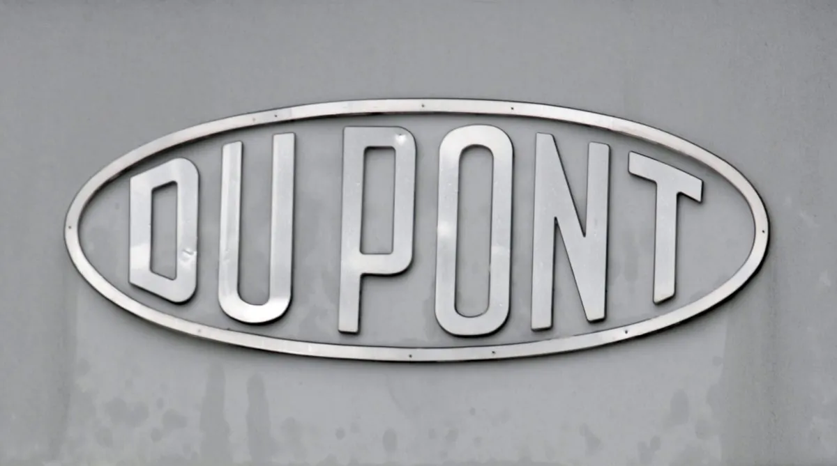 In this April 22, 2008, file photo, the DuPont logo is seen on a sign at the entrance to the company's Spruance Plant in Richmond, Va. DuPont said Tuesday, Dec. 29, 2015. (Steve Helber/AP Photo)
