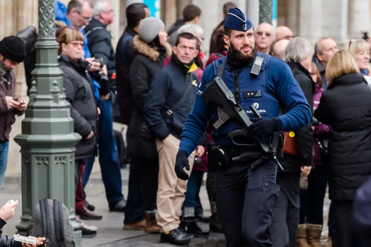 An armed police man patrols at the Grand Place in Brussels on Tuesday, Dec. 29, 2015.  (AP Photo/Geert Vanden Wijngaert)