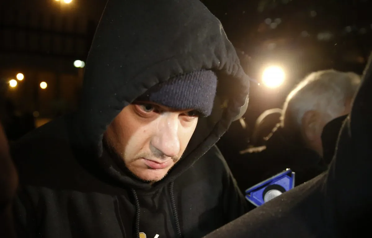 Chicago Police Officer Jason Van Dyke leaves the Cook County Jail after posting bond in Chicago on Nov. 30, 2015. Van Dyke, who is charged with murder in the shooting death of a black teenager is expected to enter a plea at an arraignment in Chicago on Dec. 29, 2015. (AP Photo/Charles Rex Arbogast)